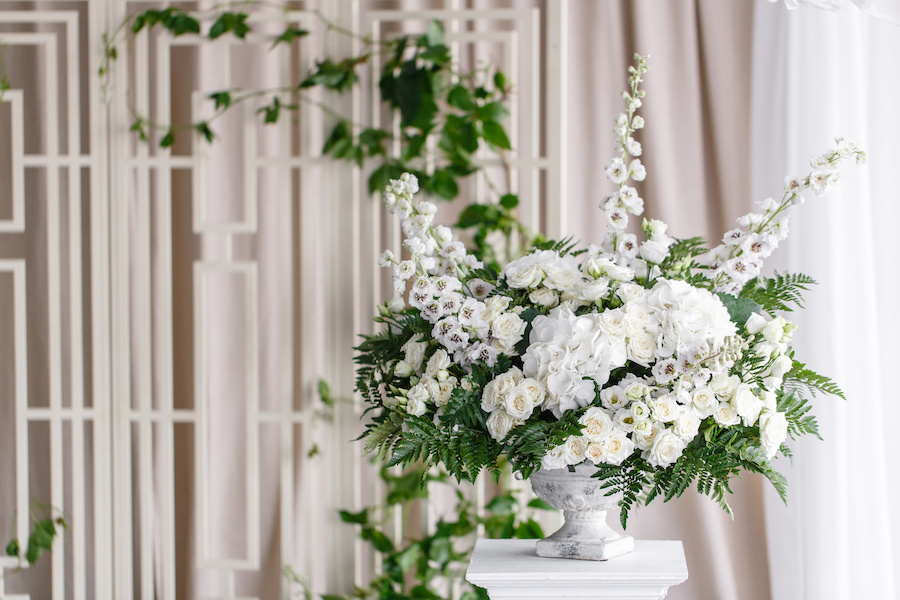 A floral arrangement incorporating ferns for texture.